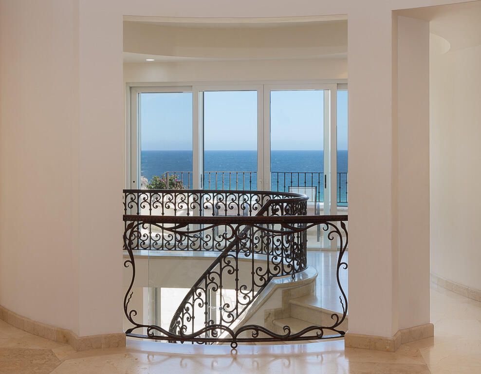 Los Cabos Los Valles Sophisticated and solidly built, this 5,588 sq.ft. estate in Club Campestre offers luxury living with exceptional construction quality rarely found in Los Cabos. Residents enjoy exclusive access to a private beach club and world-class golf course, all just minutes from San Jose vibrant dining and culture. The home features 4 ensuite bedrooms, a 3-stop elevator, and a Generac backup system. Entertain in style with a chef's kitchen, wine room with Tzalam wood cabinetry, and an outdoor BBQ area with fire pit. Relax by the heated pool or on the Jacuzzi terrace with partial ocean – 10, Hacienda Villa, Cabo San Lucas, Cabo San Lucas, BS