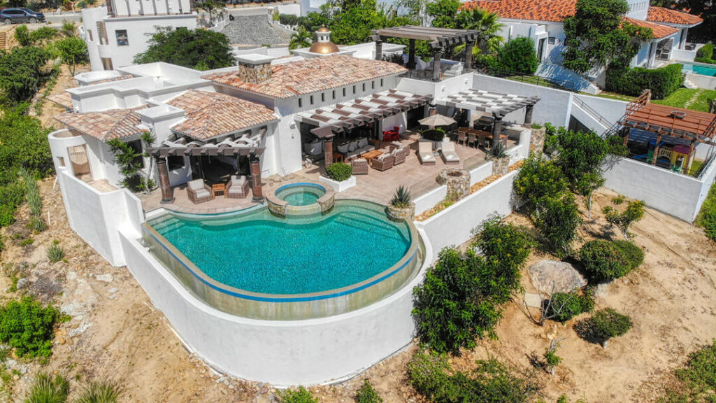 Los Cabos Palmilla Estates Discover a standout investment opportunity in coveted Palmilla Estates, where relaxed coastal style meets refined comfort. This single-story 3-bedroom, 3-bath home blends natural stone, warm wood beams, and a gourmet kitchen with high-end appliances, breakfast nook, and full bar. A generous entry courtyard opens to a heated pool, jacuzzi, outdoor kitchen, and a sun-washed yard overlooking the 9th fairway of the Jack Nicklaus Mountain Course. Eligible for a golf membership, it also makes an effortless vacation retreat with close access to Palmilla Beach, world-class amenities, and the charming San José town center. – 115 La Noria, San Jose del Cabo, BS