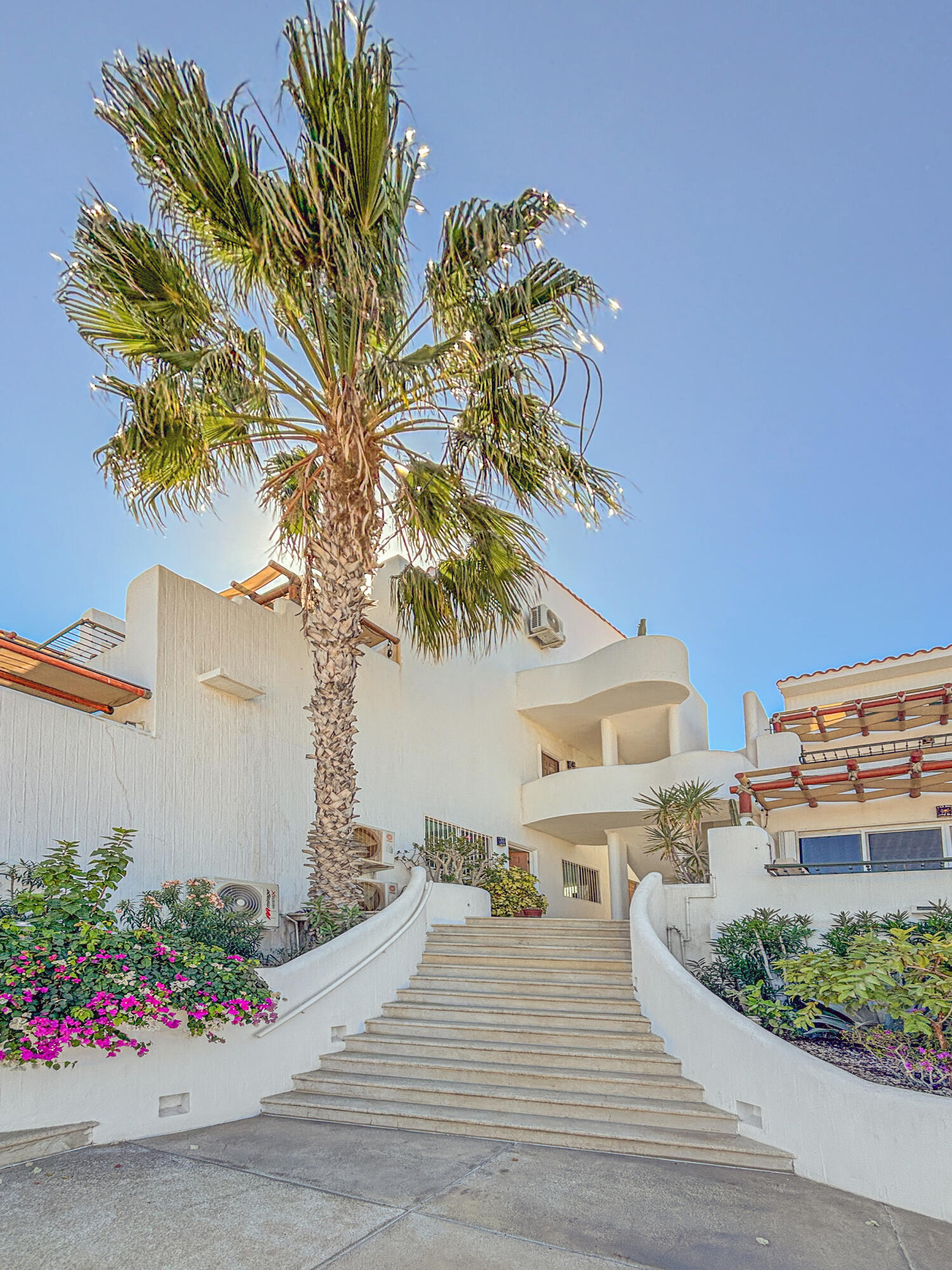 Los Cabos Dunes Residence Club Enjoy resort-style living with this 3-bedroom corner ground-floor residence at The Palmilla Dunes. This contemporary-style condo is offered fully furnished and turn-key, blending modern design with warm finishes, including travertine floors, parota wood furnishings, and GE Profile appliances. The ''Palm Garden Residence'' layout features a primary bedroom with a king bed and private terrace, plus two back bedrooms, one with two double beds and one with a king, making it ideal for family and guests. Indoor-outdoor living is seamless with pocket doors, a covered exterior terrace, and BBQ area, complemented by a private putting green perfect for fun and entertaining. An oversized one-car garage is located directly in front of the unit, and a luxury six-seater golf cart is included for convenient access to Palmilla's shopping centers, restaurants, and swimmable beach.Whether you're looking for a private vacation retreat or an investment rental, this property offers a ready-to-enjoy lifestyle, with optional access to The Dunes Club amenities, including tennis, pickleball, and paddle courts, gym and spa, semi-Olympic pool, jacuzzi, movie theater, sports bar, and clubhouse. for sale