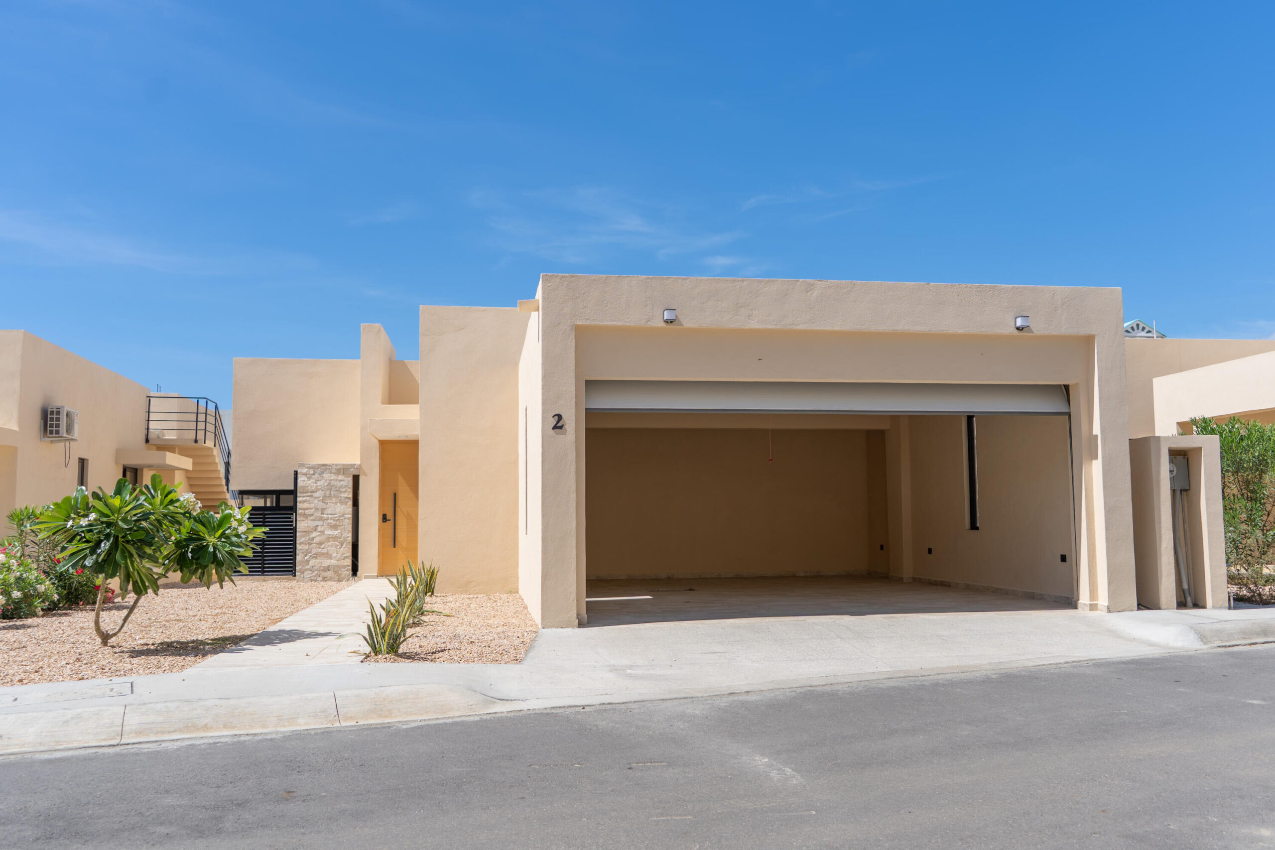 Los Cabos Las Misiones Exclusive community in El Tezal, just minutes from the beach, the Cabo Marina, and Cosco. Phase II offers only 39 homes and aclubhouse with pool, jacuzzi, gym, and social areas. The San Bernardino model features 2 levels plus a rooftop deck: open living/dining, quartzkitchen with appliances, half bath, and spacious patio. Upstairs: 3 bedrooms, 2 baths, laundry. The primary suite includes a front terrace overlookingthe community. Rooftop deck is ideal for sunsets and gatherings. Covered parking for 2, high-end finishes, closets, marble vanities, and AC minisplits included. Select homes ready for immediate delivery. – 357 Calle Crispen Cesena, Cabo Corridor, BS