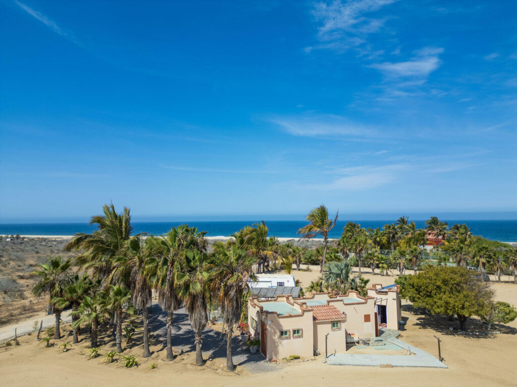 Los Cabos Elias Calles Welcome to Rancho 82 -- a rare 2.4-acre oceanfront property offering 190 feet of Pacific coastline, two charming Baja-style homes, and endless potential. With five titled lots, and easy access from Highway 19, this property could become a family compound, boutique retreat, or collection of oceanfront villas. The main home offers 3 bedrooms and 3 baths; the guest casita includes 3 bedrooms, 2 baths, and a rooftop terrace. Both feature authentic Mexican craftsmanship, handmade tiles, and sweeping ocean – Casa Mariposa, Pacific, Pacific, BS